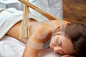 Massage with bamboo sticks