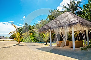 Massage bed on the exotic sandy beach