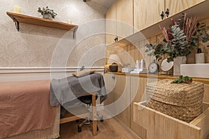 Massage cabin with wooden stretcher and wooden