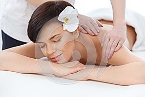 Massage. Close-up of a Beautiful Woman Getting Spa treatment