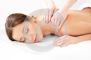 Massage. Close-up of a Beautiful Woman Getting Spa Treatment