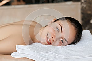 Massage.  Close-up of young woman getting spa massage treatment at beauty spa salon.Spa skin and body care. Facial beauty treatmen