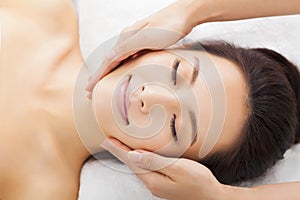 Massage of face for woman in spa