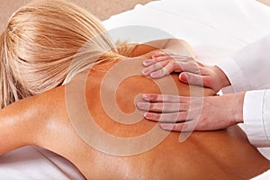 Massage of female back. Spa.