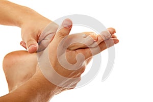 Massage foot female close-up isolated on white