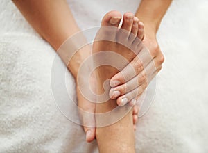 Massage, foot and spa or salon treatment, beautician and pedicure for wellness and self care. Physiotherapy, reflexology