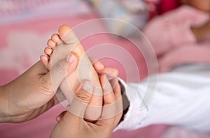 Massage the soles of children`s feet