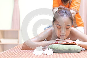 Massage and spa for healing and relaxation. Young woman getting traditional Thai stretching