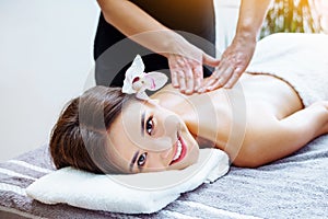 Massage and spa. Relaxing body massage for beautiful asian young woman.