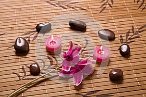 Massage stones composition on bamboo placemat