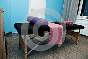 Massage table with towels, head pillow in the massage room