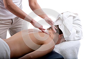 Massage therapist doing back massage