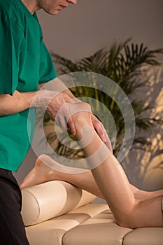 Massage therapist doing functional massage photo