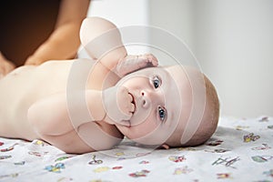 Massage therapist working with cute baby child in medical center