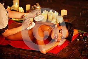 Massage woman spa salon. Female have herbs hot ball therapy.