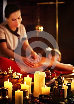 Massage of woman in spa salon. Luxary interior oriental therapy .