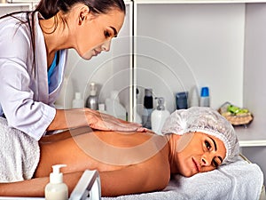 Massage woman therapist making manual therapy back.