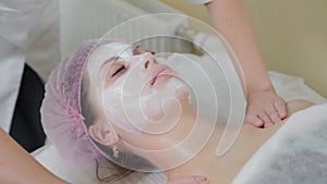 Massagist doctor making myoplastic neck massage for young woman, closeup view. Beauty spa procedure in cosmetology