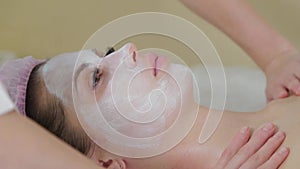 Massagist doctor making myoplastic neck massage for young woman, closeup view. Beauty spa procedure in cosmetology