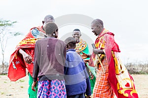 Massai family celebrating and dancing