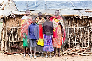 Massai family looking in camera