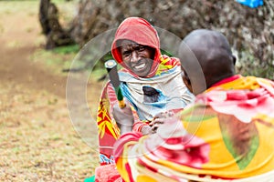 Massai men shaking hand concluding an agreement