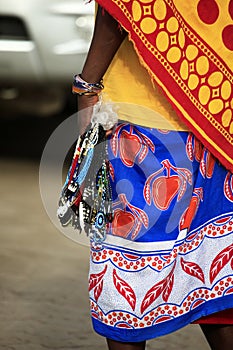 Massai woman sells souvenirs to tourists