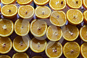 Massed juicy oranges displayed on market stall