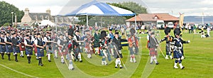 Massed Pipe bands marching at Nairn.