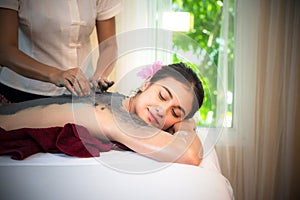 Masseur doing massage spa with treatment mud on Asian woman body in the Thai spa lifestyle, so relax and luxury.