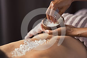 Body scrub with salt at spa photo