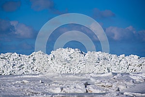 Massive area with huge ice stack in sea.