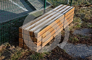 Massive bench with a stack of 12 pieces of prisms in one block with gaps. airy and at the same time massive impression of a park b