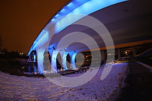 Massive Bridge and Supports with Blue Lights at Night