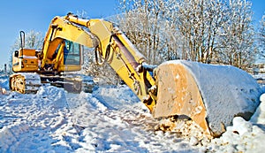 Massive bulldozer, work stopped for winter