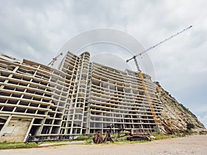 Massive concrete house taking shape, a work in progress. Construction site showcases modern design and sturdy photo