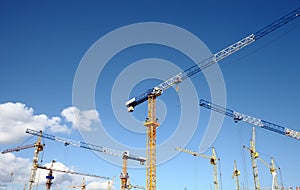 Massive construction with a plurality of tower cranes photo