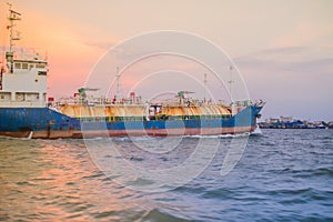 Massive container ship for import export and business logistic. Big cargo ship is leaving from Bangkok Port Authority of Thailand