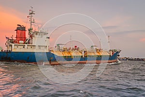 Massive container ship for import export and business logistic. Big cargo ship is leaving from Bangkok Port Authority of Thailand