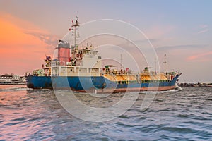 Massive container ship for import export and business logistic. Big cargo ship is leaving from Bangkok Port Authority of Thailand