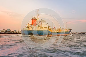 Massive container ship for import export and business logistic. Big cargo ship is leaving from Bangkok Port Authority of Thailand