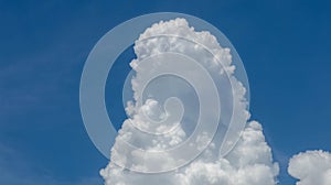 Massive cumulus cloud builds vertically before the storm