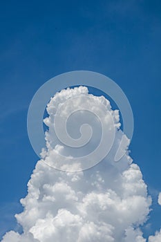 Massive cumulus cloud builds vertically before the storm