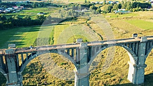 Massive deserted bridge with a lady tourist crossing it