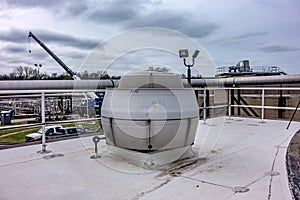 Massive exhaust ventialtion fan on roof of industrial plant