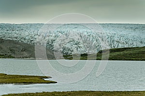 Massive front of the Russell glacier reaching glacial lake, Greenland