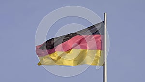 Massive German flag flies in slow motion in strong breeze