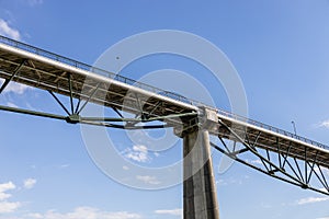 Massive industrial steel and cement construction structure of the bridge