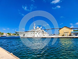 Massive luxury yacht docked near bridge on Curacao