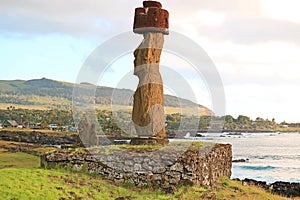 Massive Moai Statue with Pukao Hat of Ahu Ko Te Riku Ceremonial Platform on the Pacific West Coast, Easter Island, Chile photo